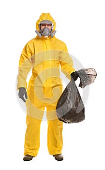 Man in chemical protective suit holding trash bag on background. Virus research