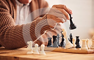 Man, chess and hand for moving, game or competition with focus, strategy or problem solving at desk. Person, master and