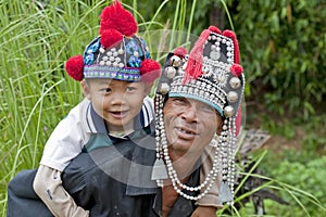 Man with child in Asia, Akha