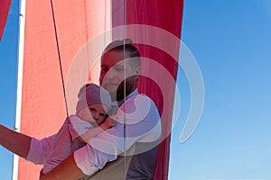 Man with a child on a sailing ship