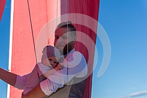 Man with a child on a sailing ship