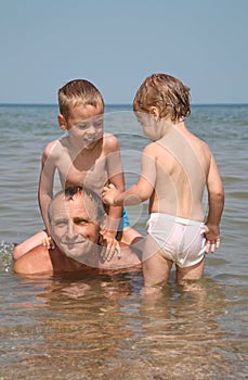 Man with child in sea