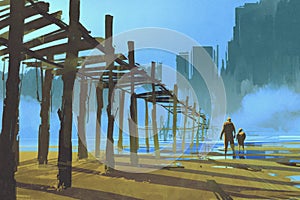 Man and child walking under the old wooden pier