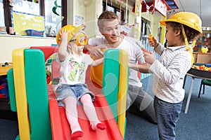 Man with children playing together