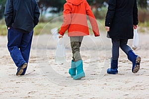 Man and children walking at the beach