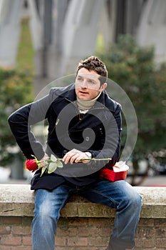 Man with chocolates and a rose being stood up