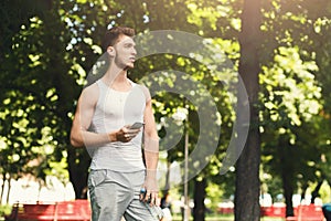 Man choose music to listen during workout