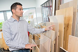 man chooses boards for home improvement