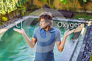 Man chooses chemicals for the pool chlorine or oxygen. Swimming pool service and equipment with chemical cleaning