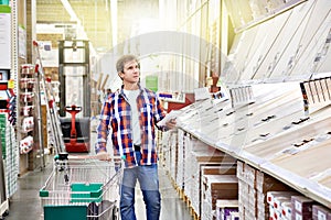 Man chooses floorboard for home renovation