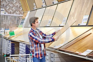 Man chooses floorboard for home renovation