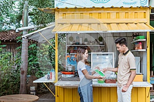 Man chooses food in menu