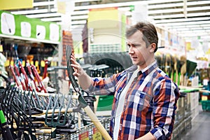 Man chooses pitchfork hay in store