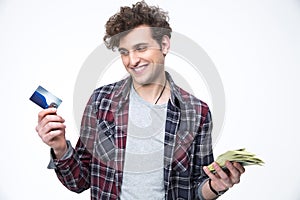 Man choosing between banking card or cash