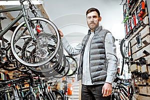 Man choosing bicycle at the store