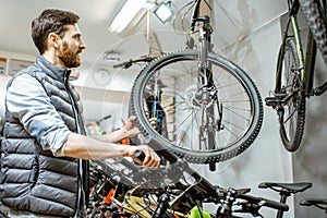 Man choosing bicycle at the store