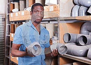 Man choosing building materials in shop