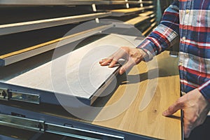 Man choosing kitchen countertop materials