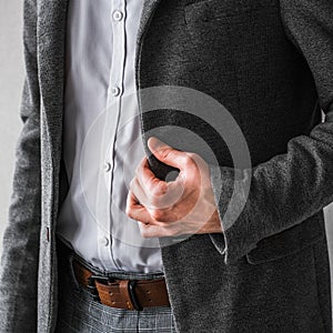 A man in a classic gray jacket and white shirt on a light background. businessman in a suit. mockup