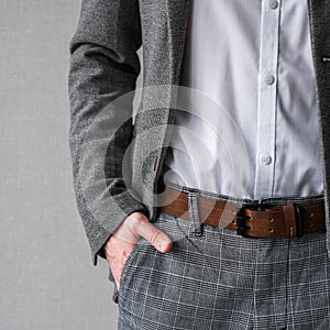 A man in a classic gray jacket and white shirt on a light background. businessman in a suit. mockup
