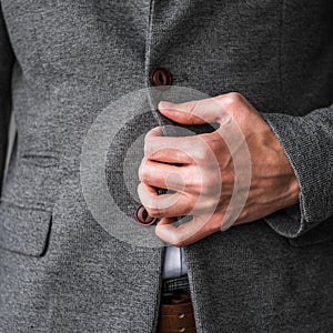 A man in a classic gray jacket and white shirt on a light background. businessman in a suit. mockup