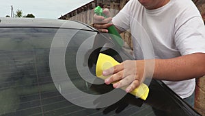 Man clean carMan clean car back window