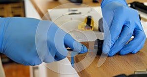 Man cleaning bicycle parts on counter 4k