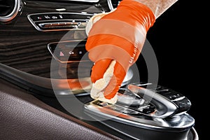 A man cleaning car with microfiber cloth. Car detailing or valeting concept. Selective focus. Car detailing. Cleaning with sponge. photo