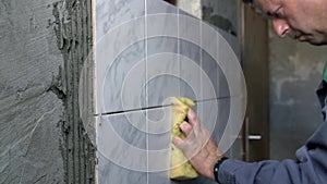 Man cleaning ceramic tiles