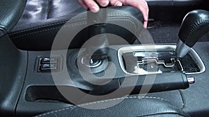 Man cleaning dirty car interior with vacuum cleaner