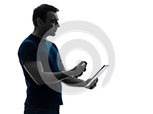 Man cleaning dusting digital tablet silhouette