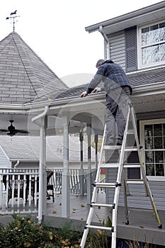 Man cleaning Eaves troughs