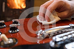 Man cleaning the guitar