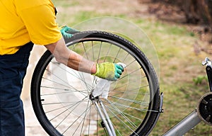 Man cleaning his bicycle for the new season