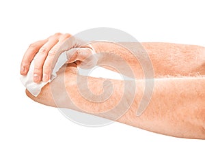 Man cleaning his hand with wet tissue isolated on white background