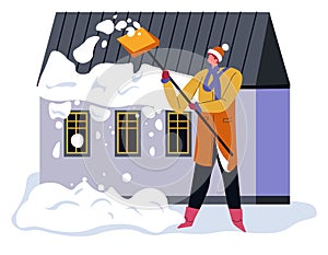 Man cleaning snow by house, wintertime outdoors