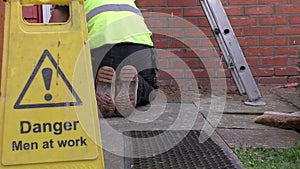 Man cleaning up construction waste