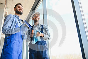 A man cleaning windows. cleaning team of men washes the windows