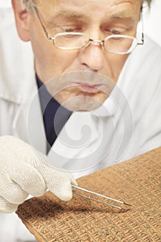 Man cleaning writing in Sumer style cuneiform no real meaning