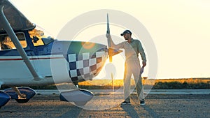 Man cleans a propeller of a plane. 4K.