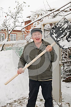 The man cleans snow.