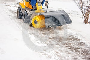 Man cleans snow machines