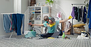 A man cleans together with child, sits on the bathroom floor, laundry room, and mops the floor with rubber gloves. Young