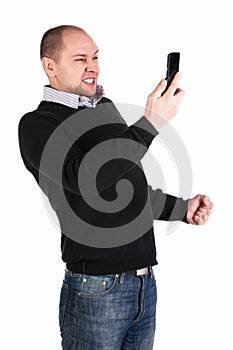 Man with clenched fist and mobile phone