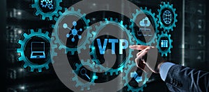 The man clicks on the inscription VTP. VLAN Trunking Protocol. Virtual Local Area Network