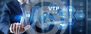 The man clicks on the inscription VTP. VLAN Trunking Protocol. Virtual Local Area Network