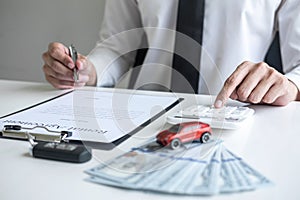 Man client calculating insurance premium for decide signing rental contract form of renting a vehicle agreement, car insurance