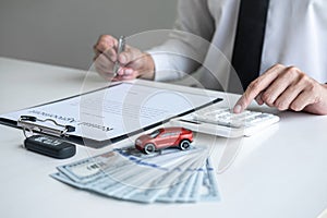 Man client calculating insurance premium for decide signing rental contract form of renting a vehicle agreement, car insurance