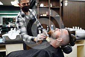 Man client visiting haidresser in barber shop, coronavirus and new normal concept.