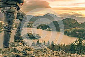 Man climbed on rocks at sunrise